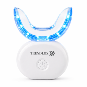 Trendlox LED teeth-whitening device with a curved blue light shield and a power button on a white base